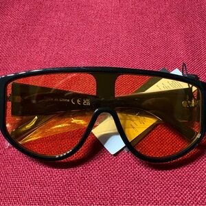 PrettyLittleThing Black Frame Amber Lens Shield Sunglasses